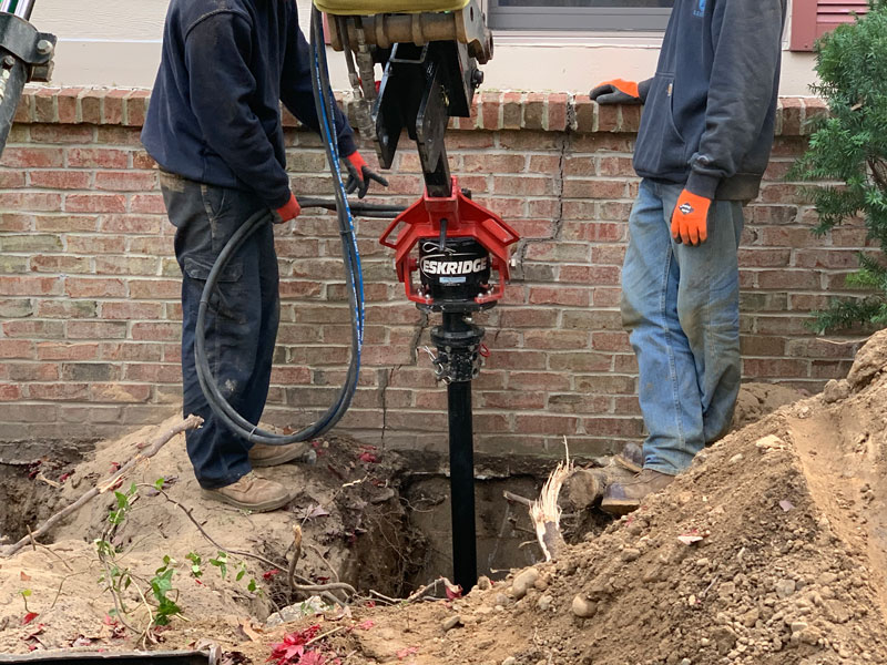 bluebird workers repairing foundation